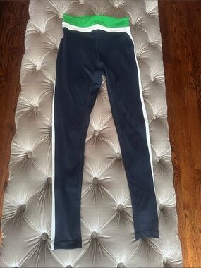 New Splits59 Navy Leggings with Green Waistband and White Side Stripes.